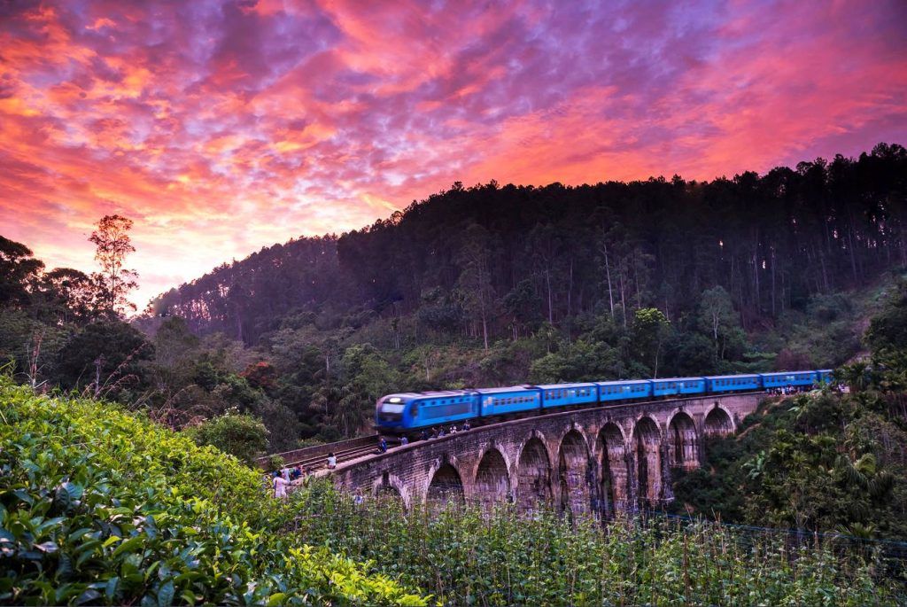 Scenic train crossing the Nine Arch Bridge in Ella